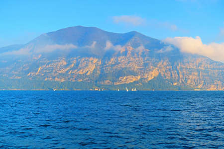 Lake Iseo in Lombardy, Italy, fed by the Oglio river.It is in the north of Italy, in the Val Camonica area, near the city of Brescia. The lake is almost equally divided between the Provinces of Bergamo and Brescia. Lake Iseo remains a natural beauty, with its green mountains surrounding the crystal clear lake.の写真素材