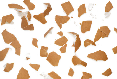Isolated Broken eggshell, Top view broken eggshells stacked pattern on white background