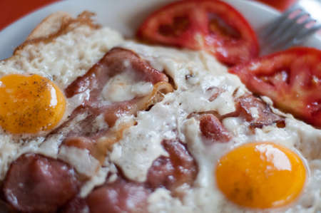 Perfectly fried eggs with bacon close upの写真素材