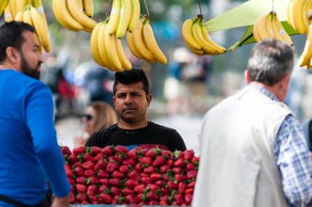 Athens, Greece - 29 April 2018: A trader sells fresh fruit on his stall in the centre of Athens, Greece.のeditorial素材