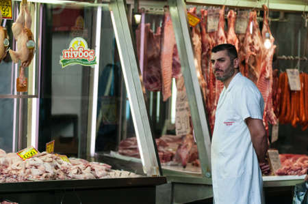 Athens, Greece - 29 April 2018: A trader looks for potential customers at the famous Greek market,...