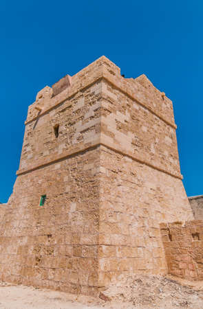 A medieveil tower in Valletta, Malta set against a clear blue skyの写真素材