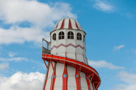 A traditional lighthouse helter skeltor on Clacton pier set againts a summer blue sky.の写真素材