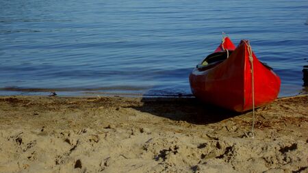 red lady on the beachの写真素材