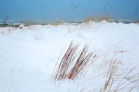 a beautiful winter scene by the lake after a stormの写真素材