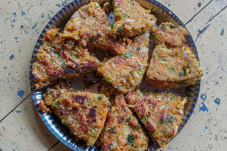 02 Jun 2020 Sevory item Mixed Vegetable Steamed Muthia and tempered with Sesame seads Lokgram Kalyan Maharashtra Indiaの写真素材