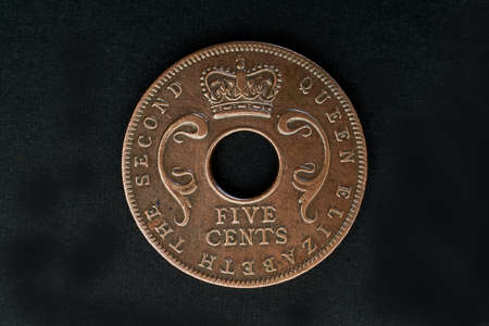 Lettering East Africa 1955 Central hole divides crown and denomination surrounded by legend studio shot Lokgram Kalyan Maharashtra Indiaの写真素材