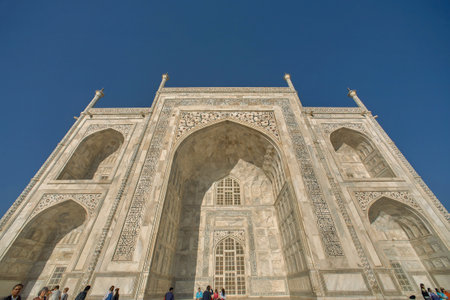 08-March-2007-sunset at the white makrana marble Taj Mahal against a blue sky and wispy clouds in Agra, Uttar Pradesh / India.のeditorial素材