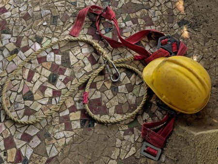 18 Feb 2021 Bright Yellow Industrial Helmet kept on Safety harness rope for construction workman Lokgram Kalyan Maharashtra Indiaの写真素材