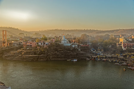 02 16 2005 Omkarehwar ghat and the Bridge on Narmada river at holy place Omkarehwar district Khandva state Madhya Pradesh India Asiaのeditorial素材