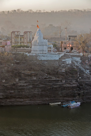 02 16 2005 Omkarehwar ghat and the Bridge on Narmada river at holy place Omkarehwar district Khandva state Madhya Pradesh India Asiaのeditorial素材