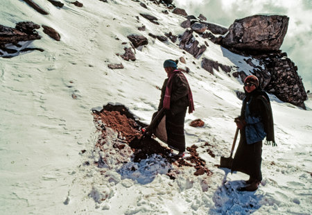 Workers Removing Snow from Rad at Selapass weather at Se La top Arunacha Pradeshのeditorial素材