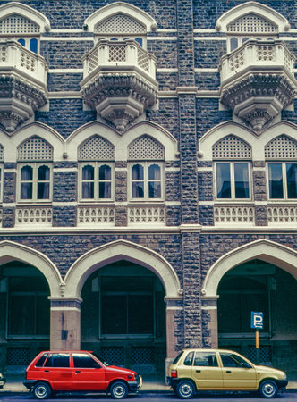 10 11 2011 Red and Yellow Cars Parked Outside Old Taj Mahal Hotel Appolo Bunder Colaba Mumbai Maharashtra Indiaのeditorial素材