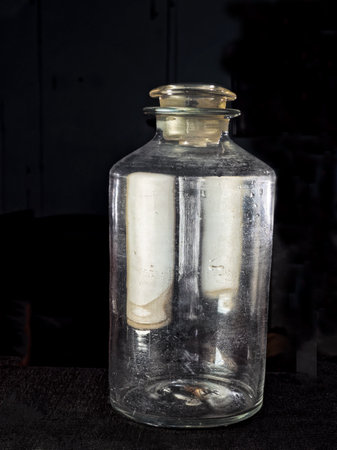06 24 2022 Vintage pontil type bottle on dark backdrop studio shot Lokgram Kalyan Maharashtra Indiaのeditorial素材