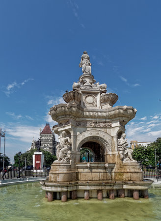 10 17 2022 Flora Fountain and Oriental Old Building at the blue sky in a sunny fort area in Mumbai, Maharashtra, Indiaのeditorial素材