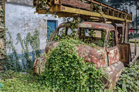 12 19 2014 Old rusty Fox Mobile Crane covered with overgrown weed Vaishali Hajipur Bihar Indiaのeditorial素材