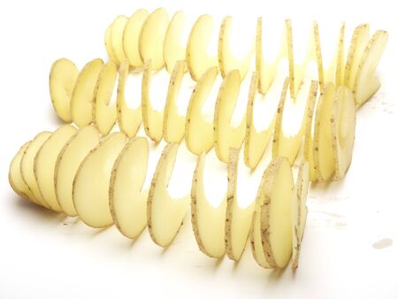 Raw potatoes cut in a spiralの写真素材