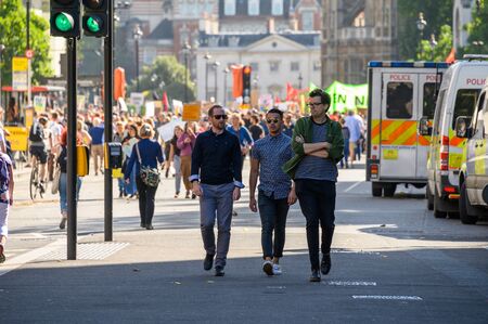 LONDON - SEPTEMBER 20, 2019: People walking ahead of an Extinction Rebellion protest march, Londonのeditorial素材