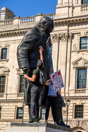 LONDON - SEPTEMBER 20, 2019: Climate Change protesters climbing on a statue of Winston Churchill at an Extinction Rebellion demonstrationのeditorial素材