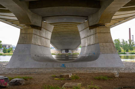 PRAGUE - JULY 20, 2019: View across the Vitava river between the legs of the Troja Bridgeのeditorial素材