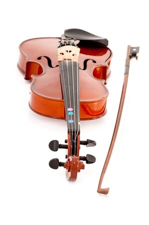 A small viola or violin and bow isolated on a white studio background.の写真素材