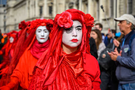 LONDON - OCTOBER 18, 2019: Close up of Red Brigade protesters at an Extinction Rebellion protest marchのeditorial素材