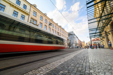 PRAGUE - JULY 20, 2019: Ground level view of tram with motion blur through old town district of Pragueのeditorial素材