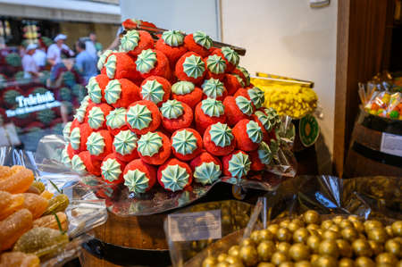 PRAGUE - JULY 20, 2019: A selection of Sweet candy confectionery stacked up and ready for sale in a shop window.のeditorial素材