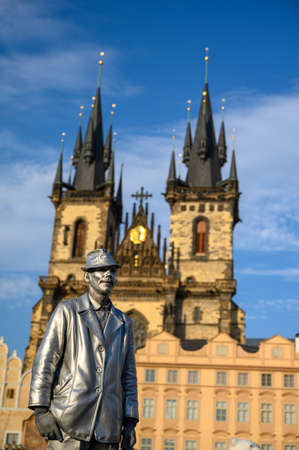 PRAGUE - JULY 20, 2019: Silver statue street performer in front of The Church of Our Lady before TÃ½n in The Old Town Square, Prague, Czech Republicのeditorial素材