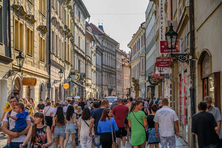 PRAGUE - JULY 20, 2019: Crowded tourist street scene between old shop buildings in Prague, Czech Republicのeditorial素材