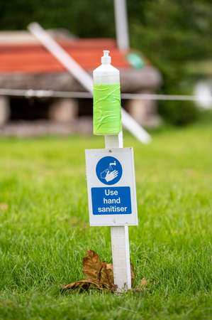 Hand sanitiser at an outdoor horse trials event as autumn approaches during Covid 19 pandemic. Horse...