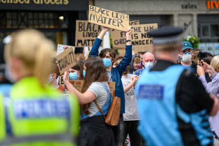 Richmond, North Yorkshire, UK - June 14, 2020: Protesters holding homemade Black Lives Matter signs wear PPE Face Masks at BLM Protestのeditorial素材