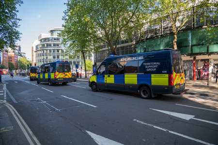 LONDON - MAY 29, 2021: Three Police Territorial Support Group vans on a London street