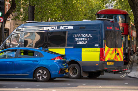 LONDON - MAY 29, 2021: A Police Territorial Support Group van in traffic on a London street