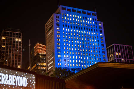 LONDON - SEPTEMBER 14, 2021: Illuminated apartment block at night seen from London's Southbankのeditorial素材