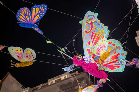 LONDON - NOVEMBER 1, 2021: Colourful butterflies suspended above Carnaby Street as part of the Christmas decorationsのeditorial素材