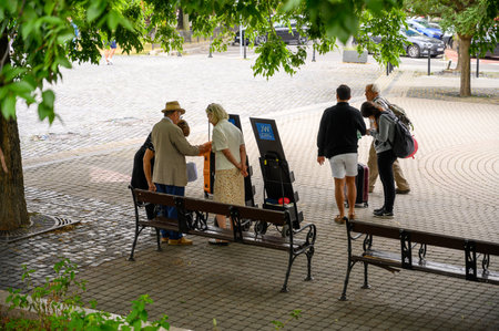 BRATISLAVA, SLOVAKIA - JULY 9, 2019: Tourists gather at a meeting point in Bratislavaのeditorial素材
