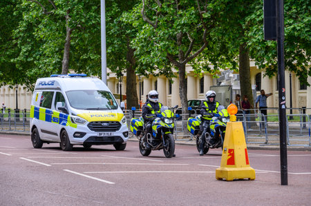 LONDON - May 18, 2022: Police motorcycles and van on The Mall, Londonのeditorial素材