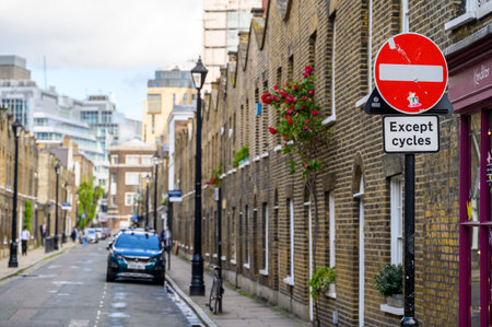 LONDON - May 20, 2022: No Entry road sign on terraced street of old brick housesのeditorial素材