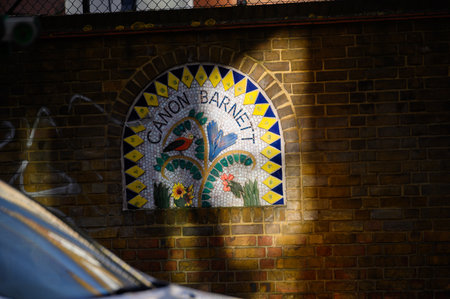 LONDON - November 2, 2020: Colourful tiled artwork on brick wall outside Canon Barnett Primary School, Commercial Street, Whitechapelのeditorial素材