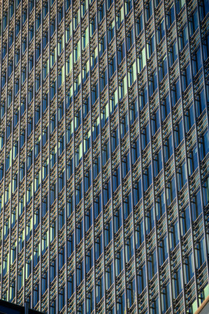 LONDON - November 4, 2020: Abstract view of modern glass and steele office building windows in Canary Wharfのeditorial素材