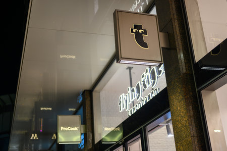 LONDON - November 12, 2022: The Flying Tiger store shines bright in the dark, its sign a beacon for...