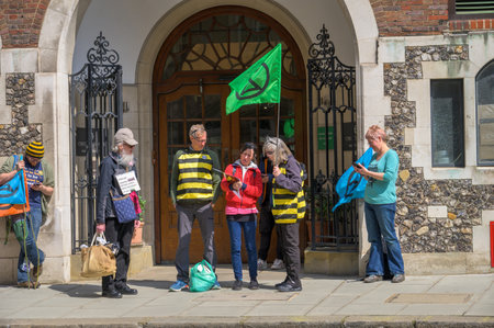 LONDON - April 22, 2023: Uniting for change: Extinction Rebellion protesters gather in preparation for the XR protest rally in London, voicing their commitment to climate action.のeditorial素材