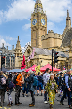 LONDON - April 22, 2023: XR's iconic stand: Big Ben and The London Eye serve as striking backdrops...