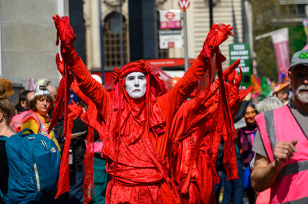 LONDON - April 22, 2023: Environmental activists: The Red Brigade joins the XR protest march,...