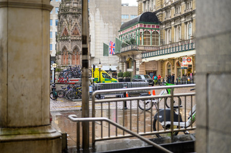LONDON - April 24, 2023: Experience a rainy day outside Charing Cross railway station in London, where commuters and travelers navigate the British weather.のeditorial素材