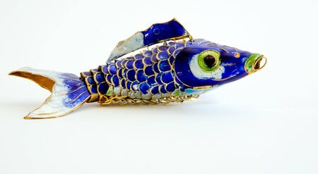 A beautifully colored metal fish trinketの写真素材