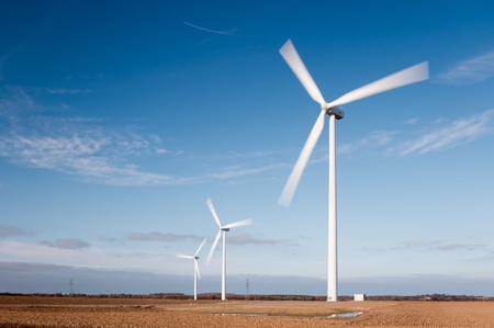 Wind turbines showing motion blur on rotating blades