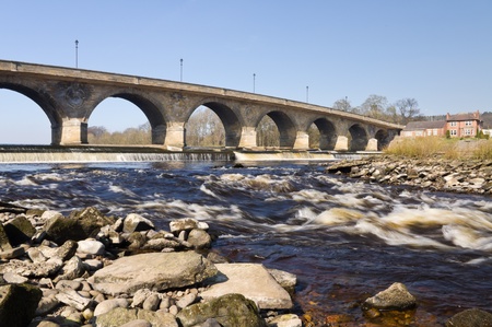 Hexham Bridge showing arches, weir and rapids downstreamの写真素材