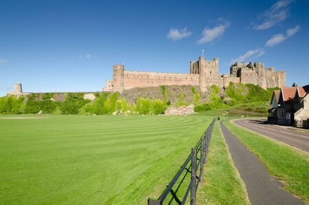 Bamburgh Castle and fence taken from the village side dates back to the 6 7th centuryのeditorial素材